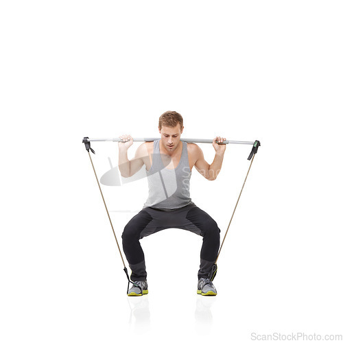 Image of Fitness, exercise and resistance band with a young man in studio isolated on a white background for health. Gym, workout or performance and a strong athlete training with equipment for wellness