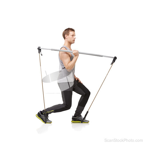 Image of Exercise, thinking and resistance band with a young man in studio isolated on a white background for health. Idea, fitness or performance and a strong athlete training with equipment for wellness