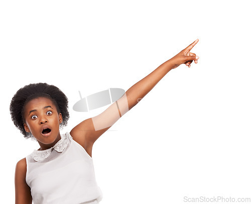 Image of Surprise, pointing and portrait of black girl in studio with mockup space for marketing or advertising. Shock, sale and African child with wow, omg or wtf face expression isolated by white background