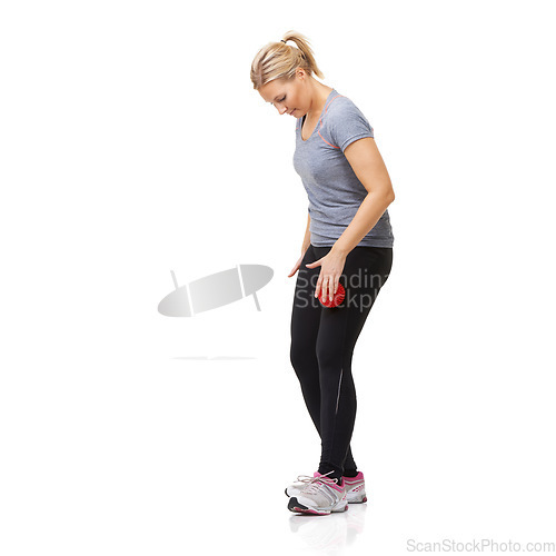 Image of Massage ball, woman and leg physio for fitness, workout and sport training injury in studio. Health, stretching and exercise equipment with female person bruise and wellness with white background