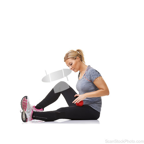 Image of Woman, massage ball and healing in studio, injury and health or wellness by white background. Female person, athlete and physical therapy or rehabilitation for muscles in legs and body in mockup