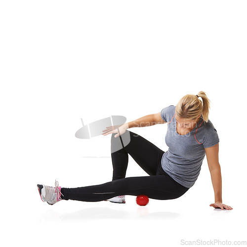 Image of Massage ball, woman and leg health for fitness, workout and sport training injury in studio. Physio, stretching and exercise equipment with female person bruise and wellness with white background