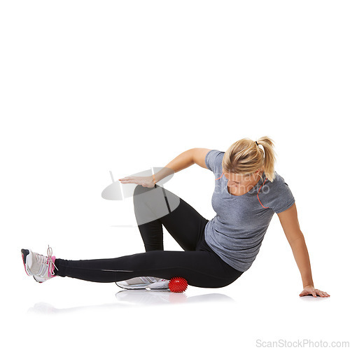 Image of Massage ball, woman pain and leg physio for fitness, workout and sport training injury in studio. Health, stretching and exercise equipment with person bruise and wellness with white background