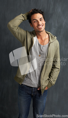 Image of Fashion, confidence and portrait of man on gray background with trendy style, clothes and casual outfit. Happy, handsome and face of person on texture wall with smile, pride and positive attitude