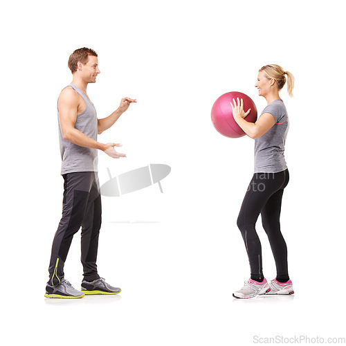 Image of Couple in studio with fitness, gym ball and coaching for exercise, body wellness and advice. Sports workout, man and woman with sphere for balance, training and personal trainer on white background.