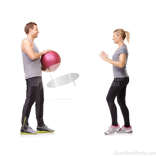 Image of Coaching, man and woman with gym ball for fitness in studio, body wellness and support. Sports workout, fit girl and personal trainer with sphere for balance, training and power on white background.