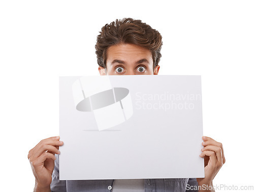 Image of Portrait, surprise and man hide on poster, sign and advertising on mockup space isolated on white studio background. Face, shock and peeking on paper banner, sales promo or blank placard presentation