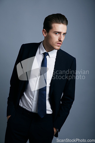 Image of Portrait, fashion and man with business, employee and confident guy on a grey studio background. Person, corporate and model with suit, elegant outfit and stylish clothes with professional and worker