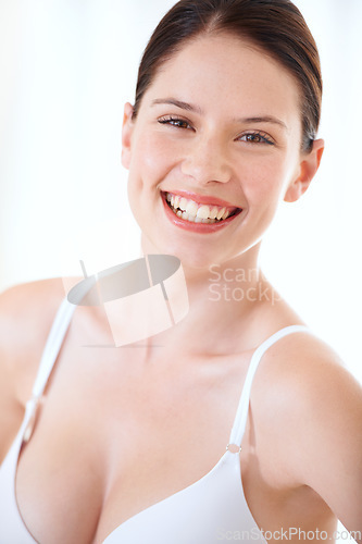 Image of Underwear, bra and happy portrait of woman with confidence in boobs in studio or white background. Sexy, lingerie and model with a smile for body positivity, fashion and self love in brassiere