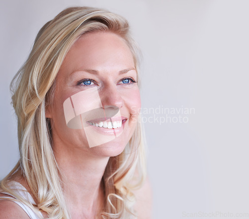 Image of Thinking, happy and a young woman with smile for idea, vision and memory with mockup space. Face, female person and excitement emoji for future, contemplating or planning on a white background