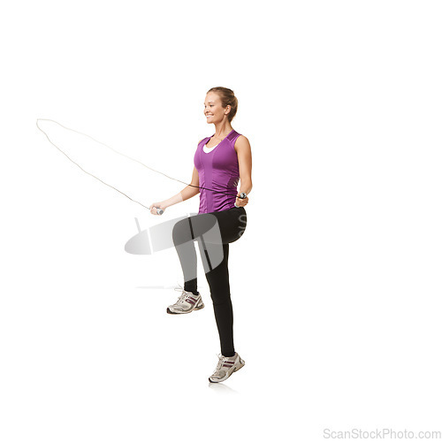 Image of Fitness, skipping rope and woman on a white background for exercise, cardio workout and training. Sports, endurance and isolated person with gym equipment for health, wellness and jumping in studio