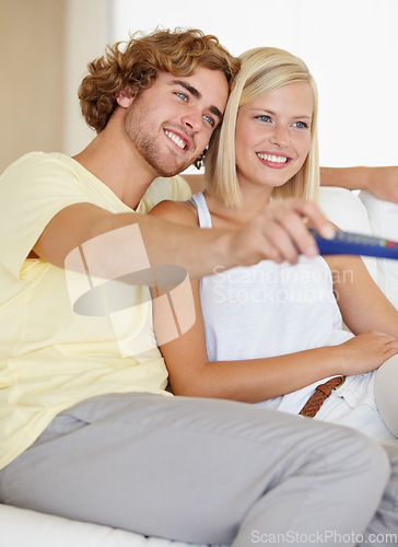 Image of Relax, remote control and couple watching tv on a sofa happy with streaming, subscription or service in their home. Love, television and couple in living room with movie, video or film entertainment