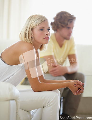 Image of Fight, divorce and couple on sofa with stress, anxiety or cheating depression in their home. Marriage, crisis and frustrated woman overthinking in living room with commitment, doubt or liar conflict