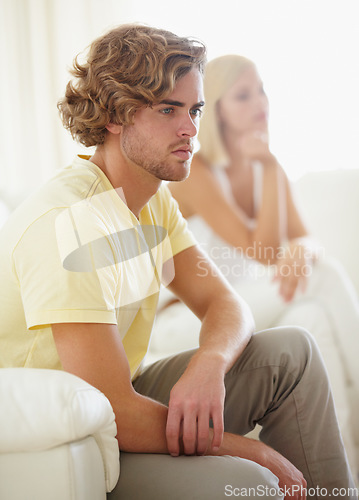 Image of Angry couple, fight and divorce stress on a sofa with argument, anxiety or cheating depression in their home. Marriage crisis, dispute and overthinking man ignore frustrated woman in a living room