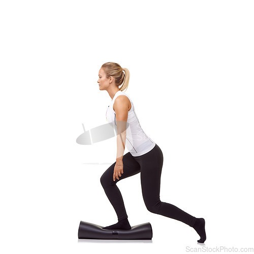 Image of Woman, lunge and workout on mat, studio profile or stretching for fitness, health or balance by white background. Girl, yoga or pilates with training, thinking or muscle development for legs on floor