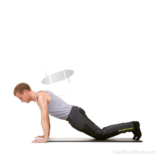 Image of Man, fitness studio and push up exercise on knees for workout, power and energy on mockup white background. Profile of healthy guy balance on mat for strong core, training or plank challenge on floor