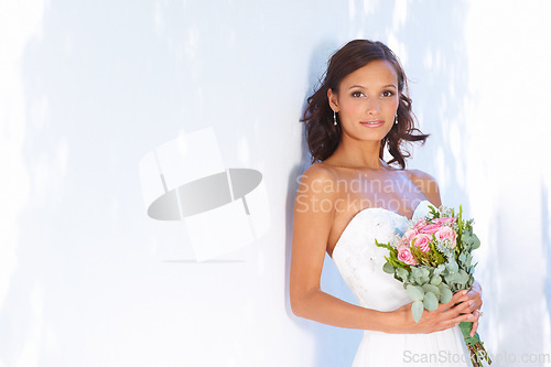 Image of Happy, wedding and bouquet with portrait of bride at venue for love, celebration and engagement. Ceremony, reception and fashion with woman and flowers in dress for event, commitment and marriage