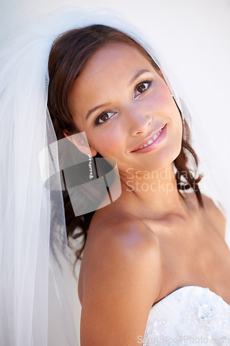 Image of Portrait, smile and a woman at her wedding for love, marriage or an event of tradition in celebration of commitment. Face, beauty and elegance with a happy young bride getting married at a ceremony