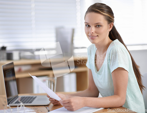 Image of Business woman, computer and paperwork for career planning, research or human resources documents in office portrait. Young worker on laptop and management of employee contract, payroll or job review