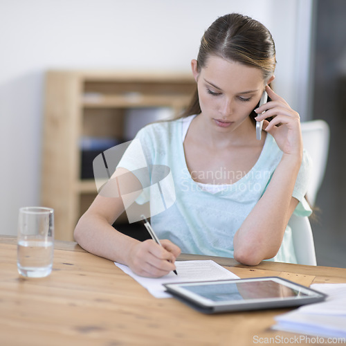 Image of Creative, woman and phone call while writing notes with tablet in office for planning research, information and communication in agency. Designer talking on cellphone with documents and digital tech