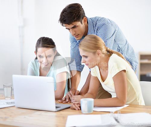 Image of Teamwork, laptop or designers planning in meeting for news, documents or paperwork together in office. Collaboration, employees or people with research on online blog website for editing project