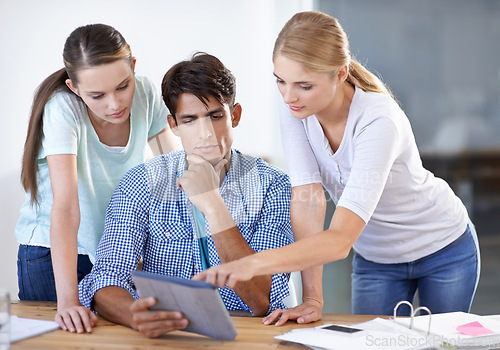 Image of Teamwork, tablet or designers in meeting for research, news or planning together in startup office. Collaboration, talking or people pointing to media info on online blog website for editing project