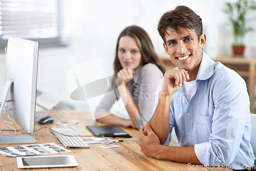 Image of Happy, smile and portrait of man in the office with positive, good and confident attitude. Career, pride and smart young male creative designer from Mexico working on project in modern workplace.