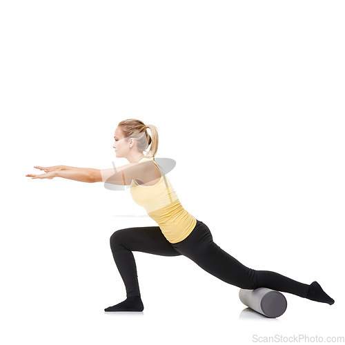 Image of Woman, foam roller and stretching body in studio with lunge exercise, fitness and yoga workout on white background. Pilates, profile and agile lady balance on tube for training, strong core and power