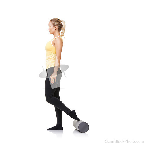 Image of Woman, foam and roller for exercise, balance and fitness workout in studio on white background. Pilates, profile and healthy lady with foot on rolling tube for training, wellness and physiotherapy