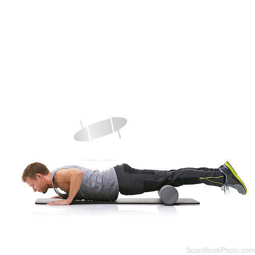 Image of Training, foam roller and man in floor push up for bodybuilding commitment, muscle growth or arm strength exercise. Plank balance, mockup studio space and male fitness athlete on white background