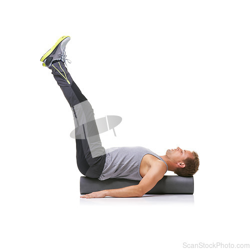 Image of Exercise, foam roller and man in pilates back workout, legs stretching or wellness for rehabilitation strength. Floor, mockup space and studio athlete fitness, balance or training on white background