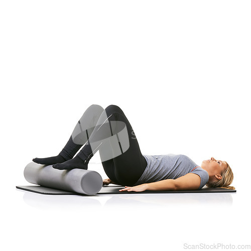 Image of Pilates, foam roller and woman in core workout, exercise or wellness for sports rehabilitation on floor. Ground, mockup space and studio athlete fitness, training and lying on mat on white background