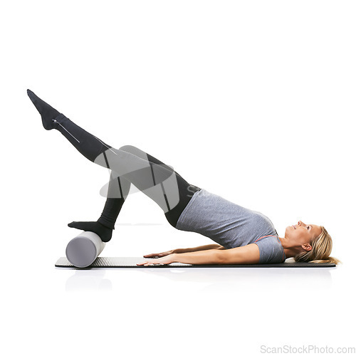 Image of Legs workout, foam roller and studio woman with bridge exercise, pilates balance or gym performance challenge. Ground, body training and athlete core muscle, strength or fitness on white background
