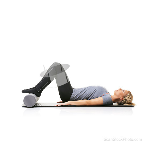 Image of Floor exercise, foam roller and studio woman workout for active lifestyle, gym pilates and rest after fitness routine. Ground, mockup space and girl body development on yoga mat on white background