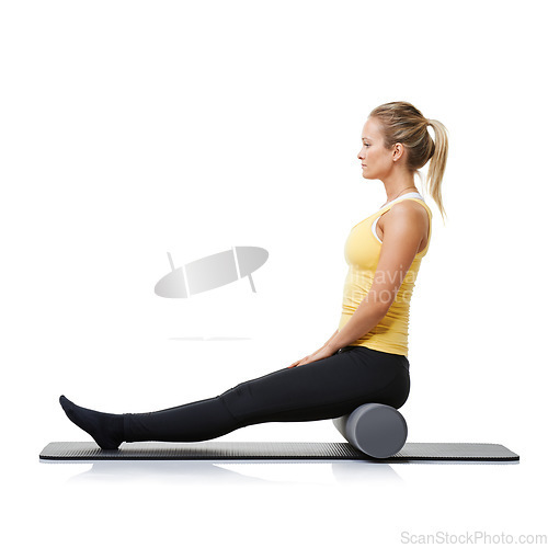 Image of Woman, foam and roller on mat for yoga, exercise or fitness workout in studio on white background. Pilates, profile or healthy lady balance on rolling tube for training, strong core or massage muscle