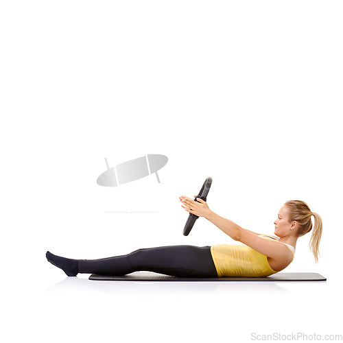 Image of Pilates ring, fitness and woman exercise in studio isolated on a white background mockup space. Training, person on mat and magic circle for crunches, strong abdomen and healthy body workout on floor