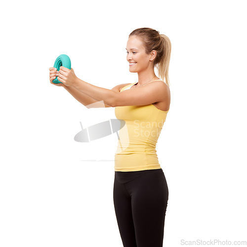 Image of Happy woman, grip and bend in resistance for arm workout isolated against a white studio background. Young female person or athlete with band or tube in exercise, training or fitness on mockup space