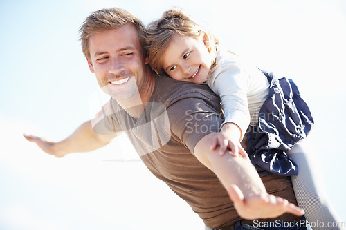Image of Happy, airplane and father with child in nature playing, having fun and bonding together. Smile, love and young dad carrying girl kid from Canada on back for playful freedom with sky in a park.
