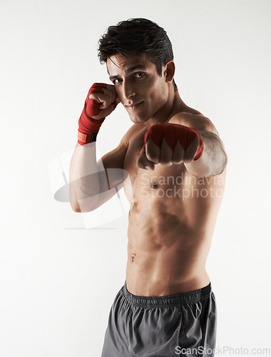 Image of Man, kick boxer and portrait in gym, serious and face for workout, boxing and strong. Exercise, sports and training for power, self defense and concentration for challenge, mma and fighting skills