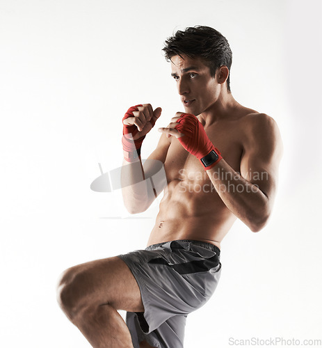 Image of Man, kick boxer and strong in gym, serious and face for workout, boxing or white background. Exercise, sports and training for power, self defense and concentrate for challenge, mma or fight skills