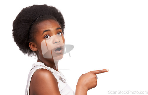 Image of Shock, pointing and portrait of black girl in studio with mockup space for marketing or advertising. Surprise, sale and African child with wow, omg or wtf face expression isolated by white background