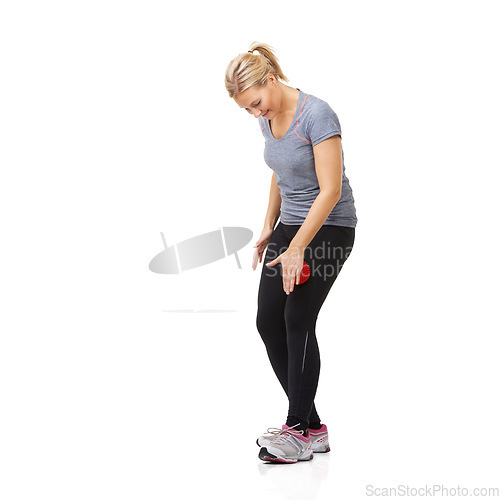 Image of Massage ball, fitness woman and leg exercise for athlete, workout and sport training injury in studio. Health, stretching and physio equipment with female person and wellness with white background