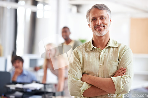 Image of Director, portrait of businessman with arms crossed for startup agency in creative company or workplace. Blurred background, mature ceo and face or happy with confidence, pride for leadership in job