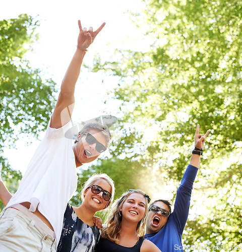 Image of Friends, face or rocker hands for park music, festival or happy social gathering. Freedom, celebration or crowd of people at forest party, concert or event in nature with excited, energy or gesture