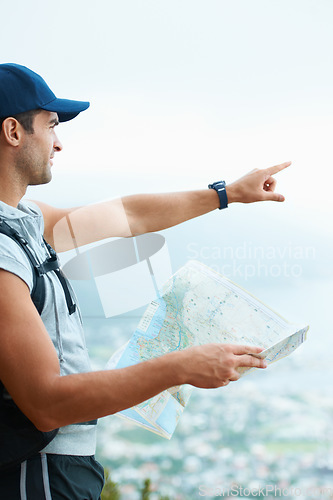 Image of Map, hiking and man with nature, pointing and adventure with direction, journey and fitness. Person, hiker and guy with wellness, outdoor ot document for location, fresh air and landscape with forest