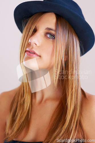 Image of Hipster, hat and portrait of woman with vintage, fashion and confidence in white background or studio. Retro, style and face of person in old fashioned fedora with makeup, cosmetics and beauty
