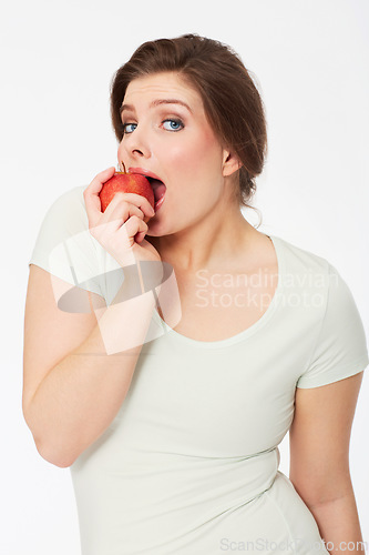 Image of Health, apple and food with portrait of woman in studio for nutrition, wellness or organic. Happy, sustainable and diet with face of female person and fruit on white background for fiber and vitamins