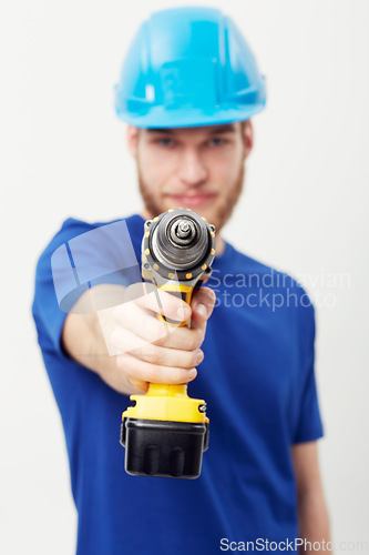 Image of Construction worker man, drill and studio portrait with hand for maintenance by white background. Person, employee or small business owner with power tools, helmet and job at repair services company