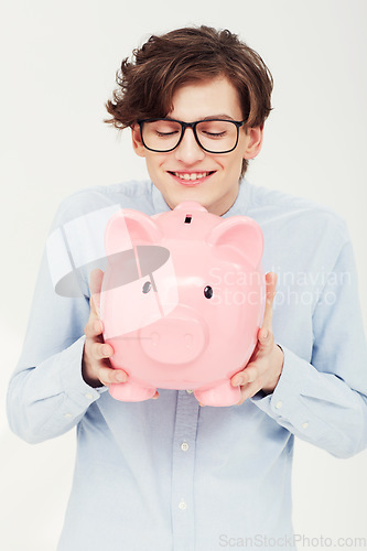 Image of Piggy bank, smile and man with finance, business and planning isolated on a white studio background. Person, model and entrepreneur with savings, transactions and investment with payment and excited