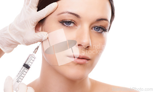 Image of Woman, portrait and needle for plastic surgery in studio for injection, chemical and product by white background. Girl patient, surgeon and syringe for change, transformation and results with beauty